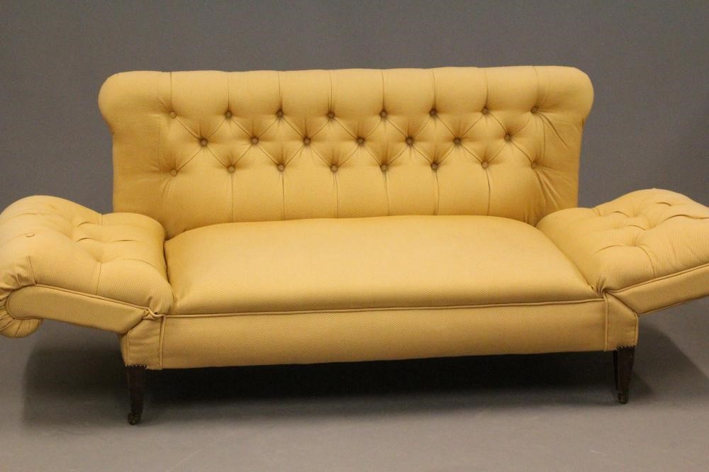 A LATE VICTORIAN MAHOGANY FRAMED DROP END SOFA of Chesterfield type Image