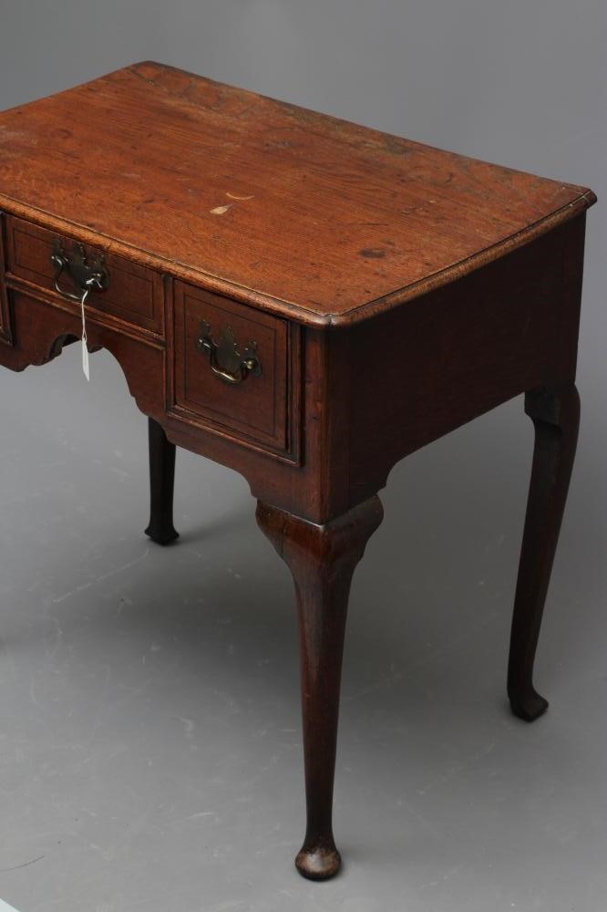 A GEORGE II OAK LOWBOY Image