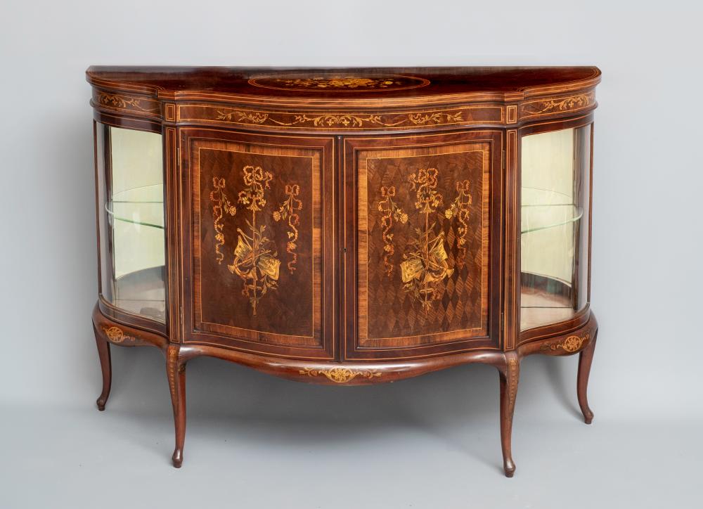 A LATE VICTORIAN MAHOGANY SALON CABINET of serpentine outline with rosewood banding Image