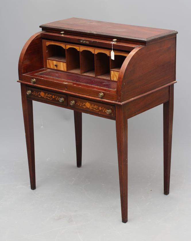 AN EDWARDIAN MAHOGANY CYLINDER BUREAU Image