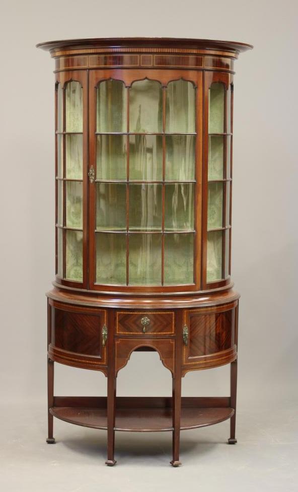 AN EDWARDIAN MAHOGANY DISPLAY CABINET of demi lune form Image