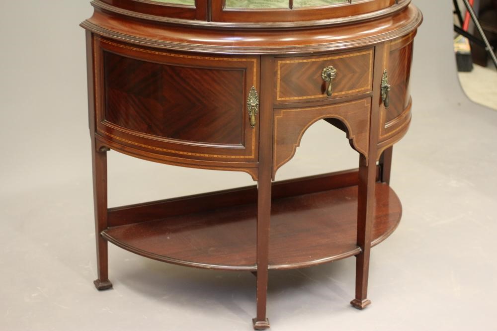 AN EDWARDIAN MAHOGANY DISPLAY CABINET of demi lune form Image