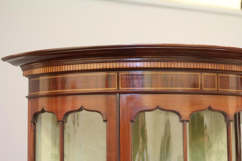 AN EDWARDIAN MAHOGANY DISPLAY CABINET of demi lune form Image