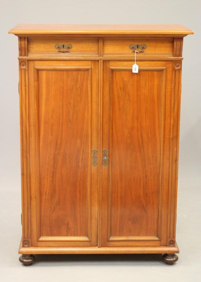 A LATE VICTORIAN WALNUT PIER CABINET in the Aesthetic taste Image