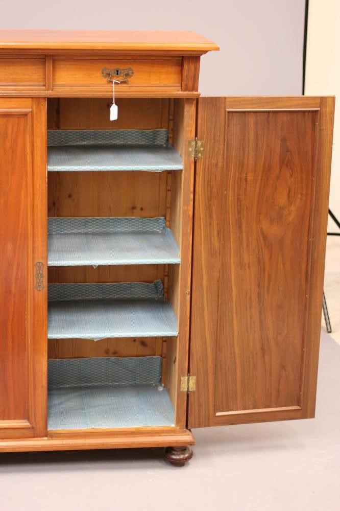 A LATE VICTORIAN WALNUT PIER CABINET in the Aesthetic taste Image