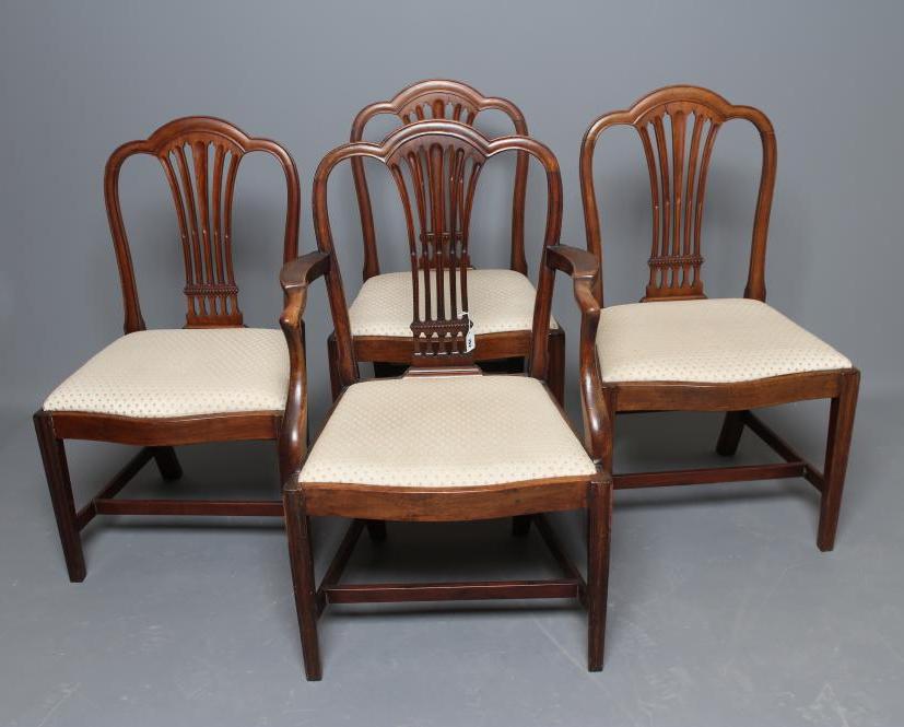 A SET OF FOUR GEORGIAN MAHOGANY DINING CHAIRS including an elbow chair Image