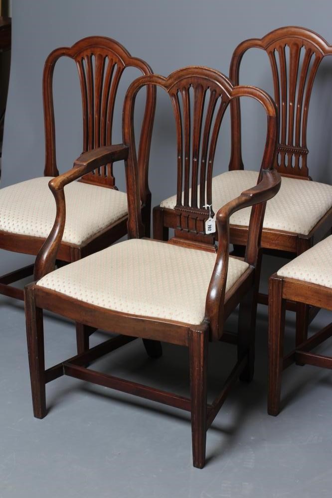 A SET OF FOUR GEORGIAN MAHOGANY DINING CHAIRS including an elbow chair Image