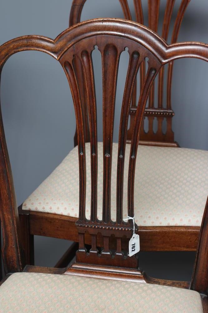 A SET OF FOUR GEORGIAN MAHOGANY DINING CHAIRS including an elbow chair Image