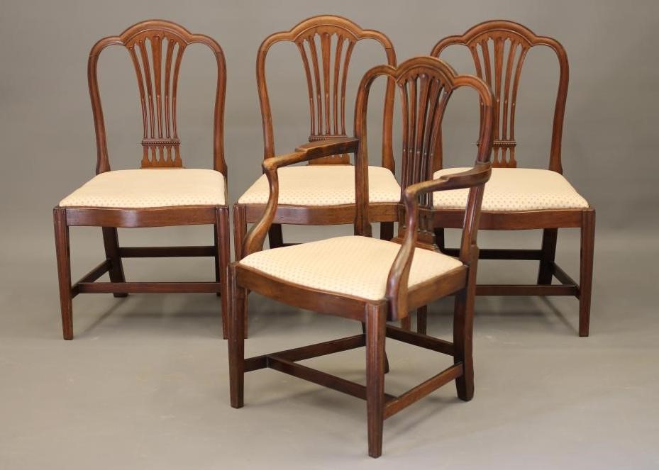 A SET OF FOUR GEORGIAN MAHOGANY DINING CHAIRS including an elbow chair Image