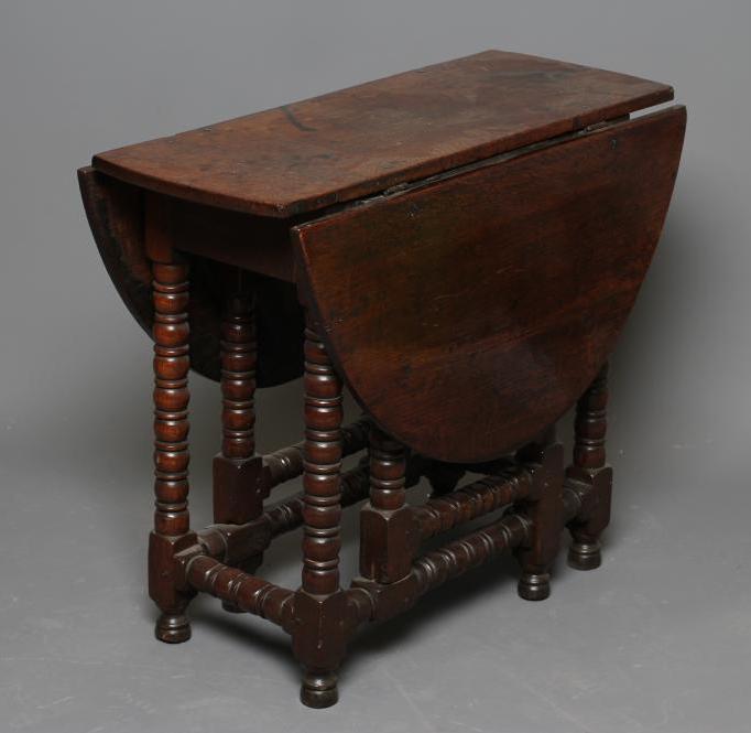 A SMALL OAK DROP LEAF TABLE Image