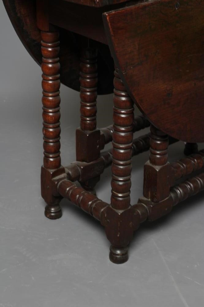 A SMALL OAK DROP LEAF TABLE Image