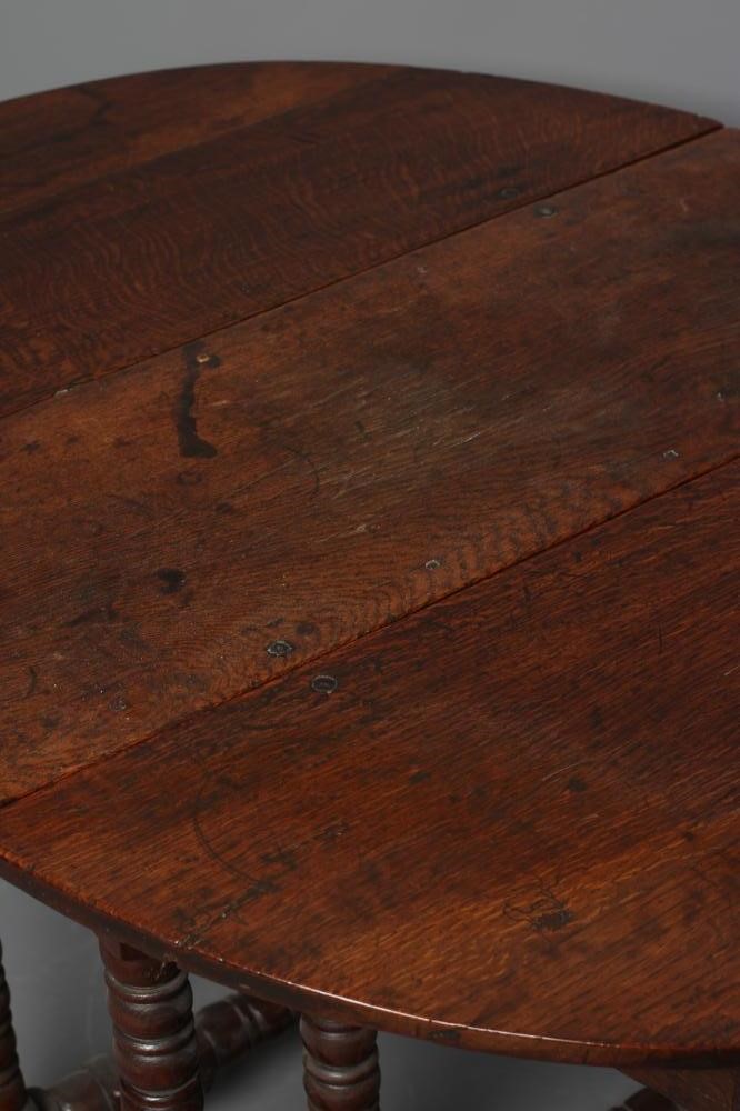 A SMALL OAK DROP LEAF TABLE Image