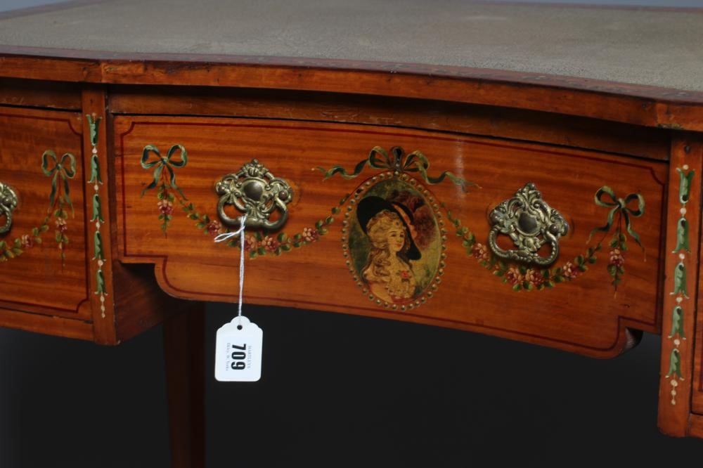 AN EDWARDIAN PAINTED SATINWOOD KNEEHOLE DESK of oblong form with stringing Image