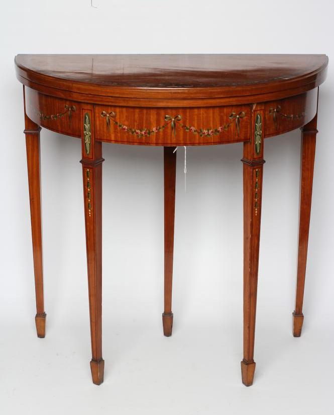 AN EDWARDIAN PAINTED SATINWOOD FOLDING CARD TABLE of demi lune form with stringing Image