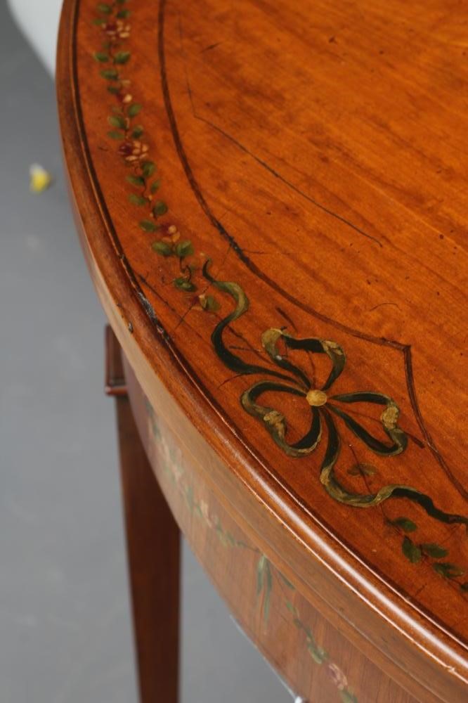 AN EDWARDIAN PAINTED SATINWOOD FOLDING CARD TABLE of demi lune form with stringing Image