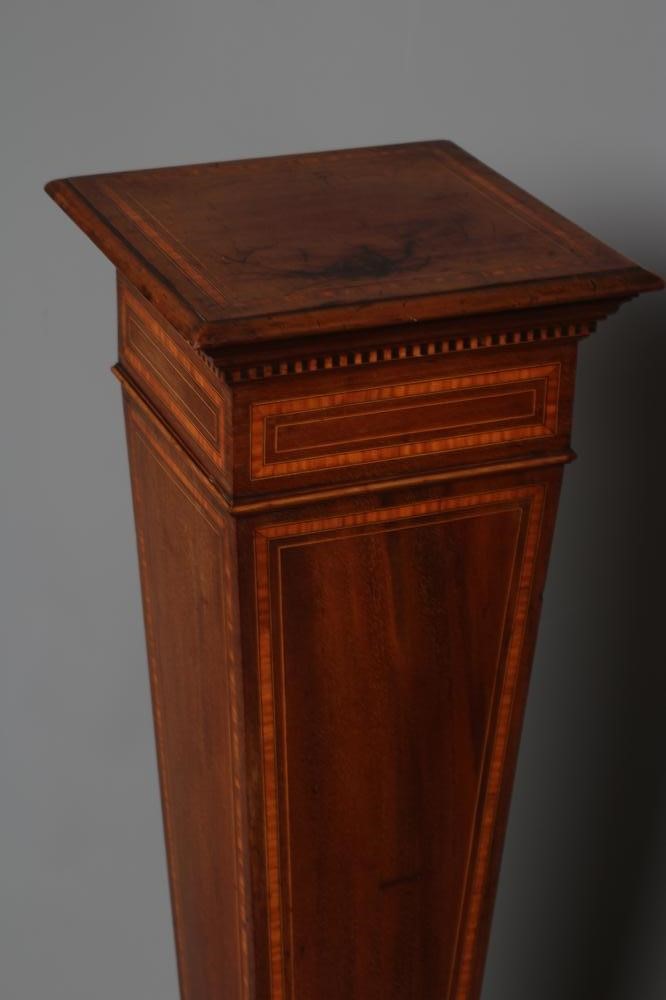 AN EDWARDIAN MAHOGANY PEDESTAL of square tapering form with stringing and satinwood banding Image