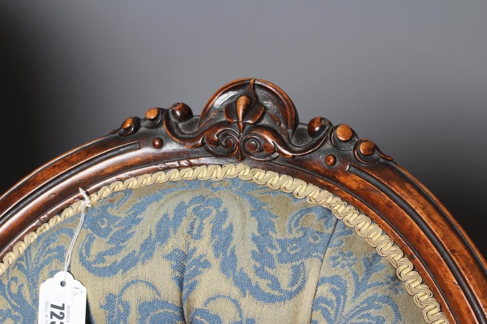A PAIR OF VICTORIAN CARVED WALNUT SALON CHAIRS Image