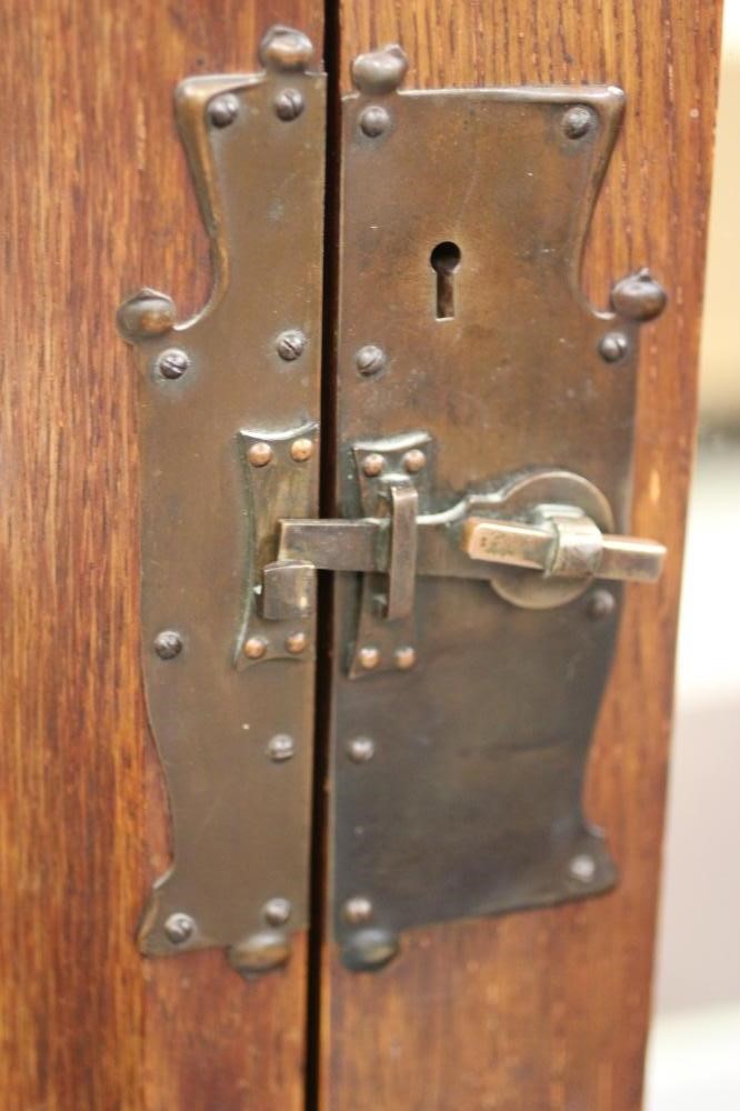 AN ARTS AND CRAFTS OAK TWO PIECE BEDROOM SUITE by Maple & Co. Image