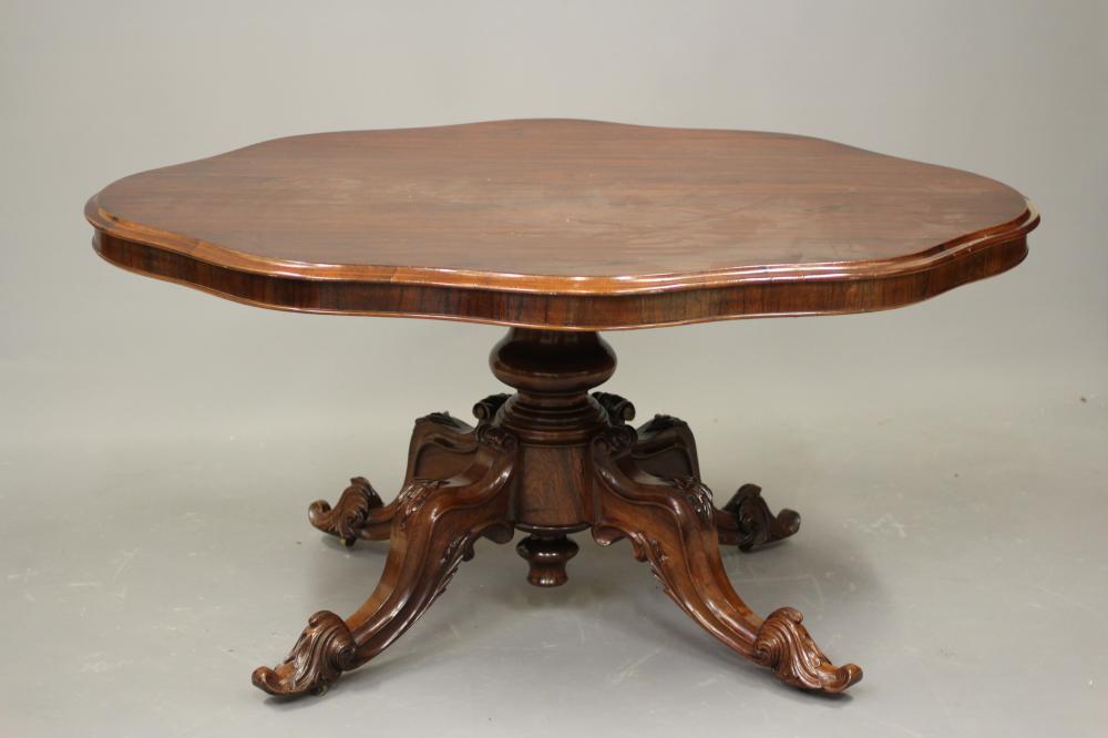 A VICTORIAN ROSEWOOD LOO TABLE of serpentine oval form Image