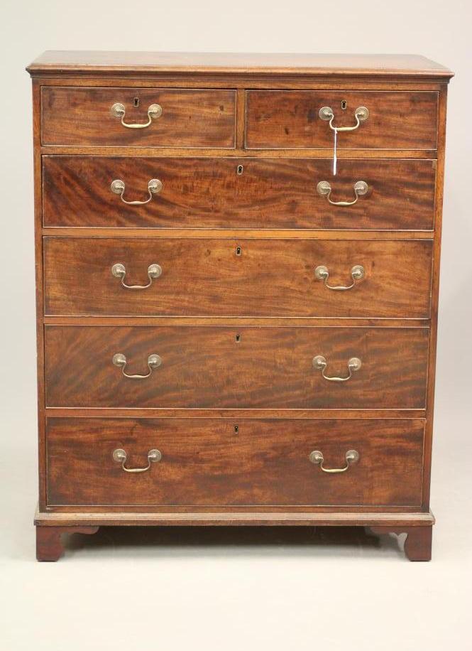 A GEORGIAN MAHOGANY CHEST of two short and four long drawers with brass drop handles Image