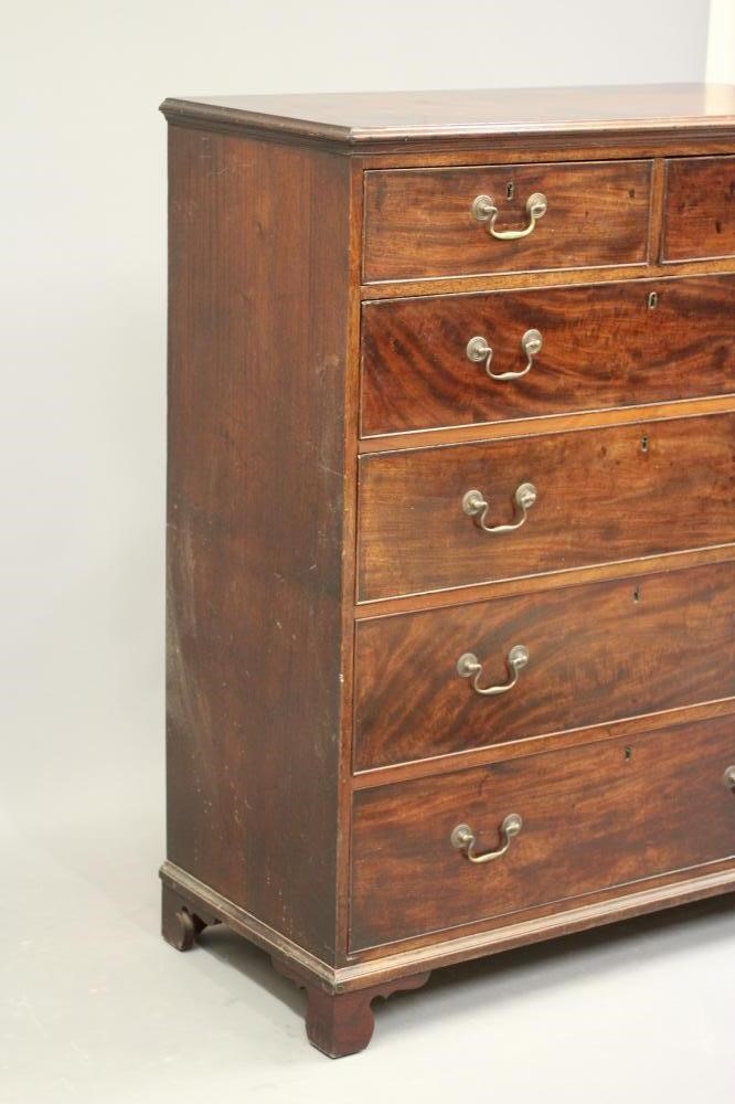 A GEORGIAN MAHOGANY CHEST of two short and four long drawers with brass drop handles Image