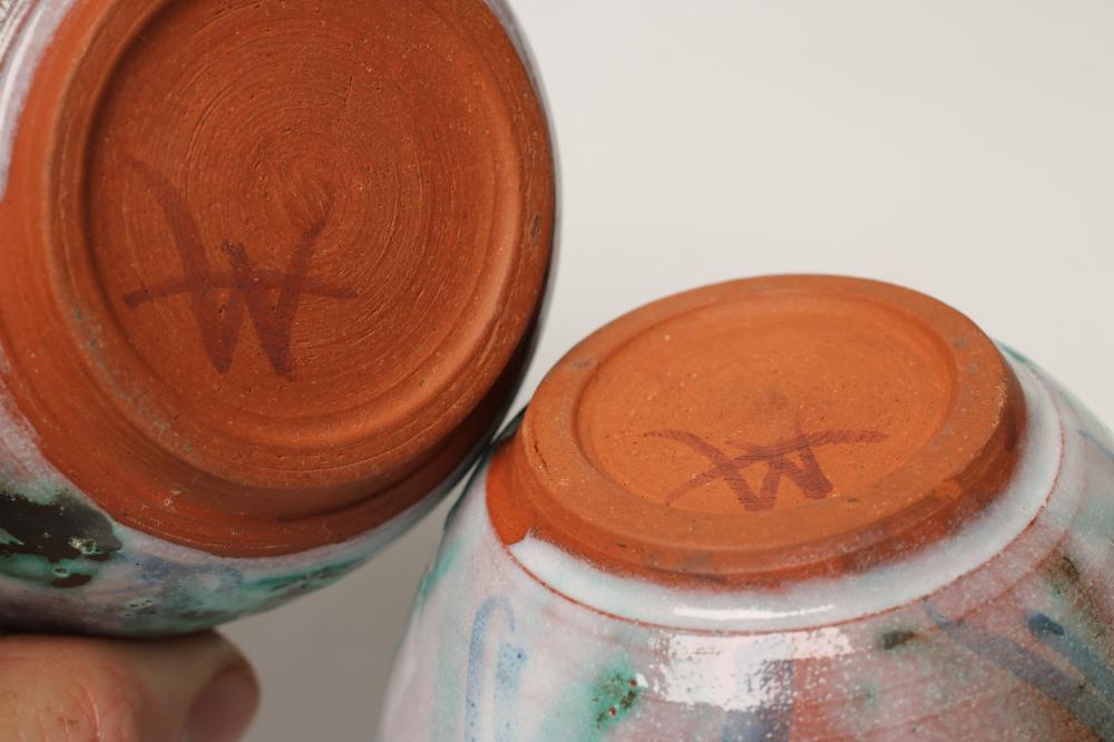 AN EDWARDIAN MAHOGANY OCCASIONAL TABLE of shaped rounded oblong form with stringing Image