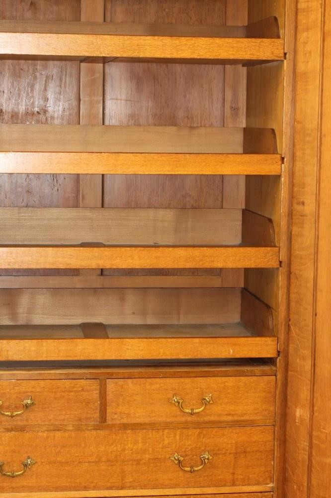 A GOTHIC REVIVAL LIGHT OAK AND BLACK STENCILLED WARDROBE Image