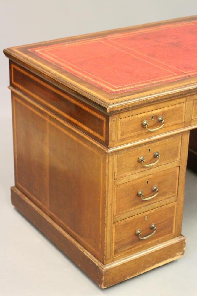 AN EDWARDIAN MAHOGANY PEDESTAL DESK with satinwood banding and stringing Image