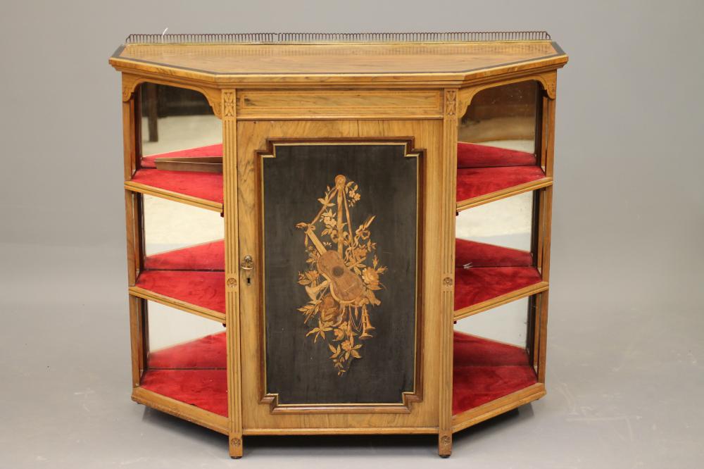 A LATE VICTORIAN ROSEWOOD AND EBONISED PIER CABINET of canted form crossbanded with stringing Image