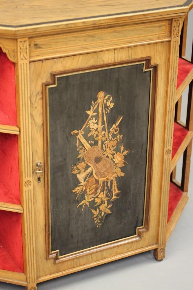 A LATE VICTORIAN ROSEWOOD AND EBONISED PIER CABINET of canted form crossbanded with stringing Image