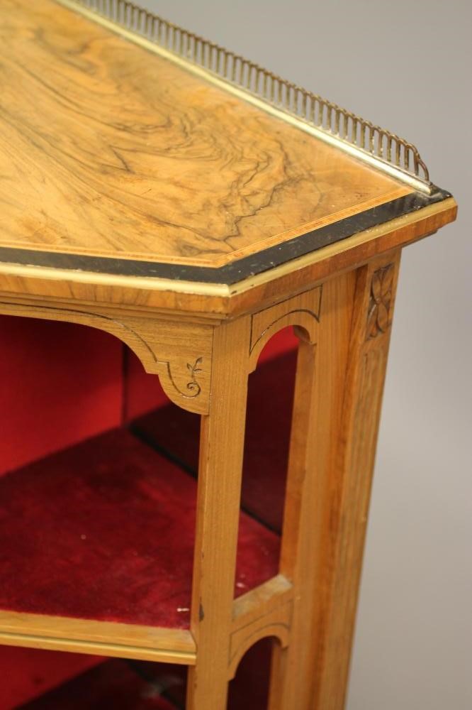 A LATE VICTORIAN ROSEWOOD AND EBONISED PIER CABINET of canted form crossbanded with stringing Image