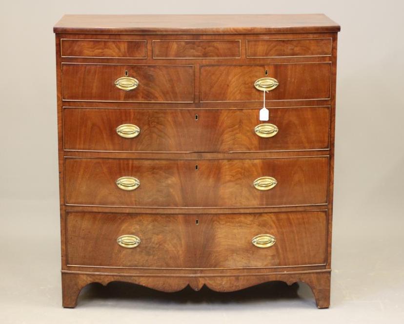 A REGENCY MAHOGANY CHEST of bowed form Image