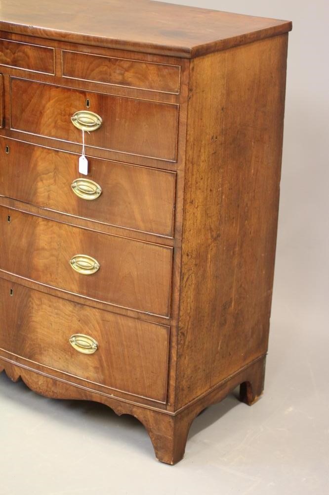 A REGENCY MAHOGANY CHEST of bowed form Image