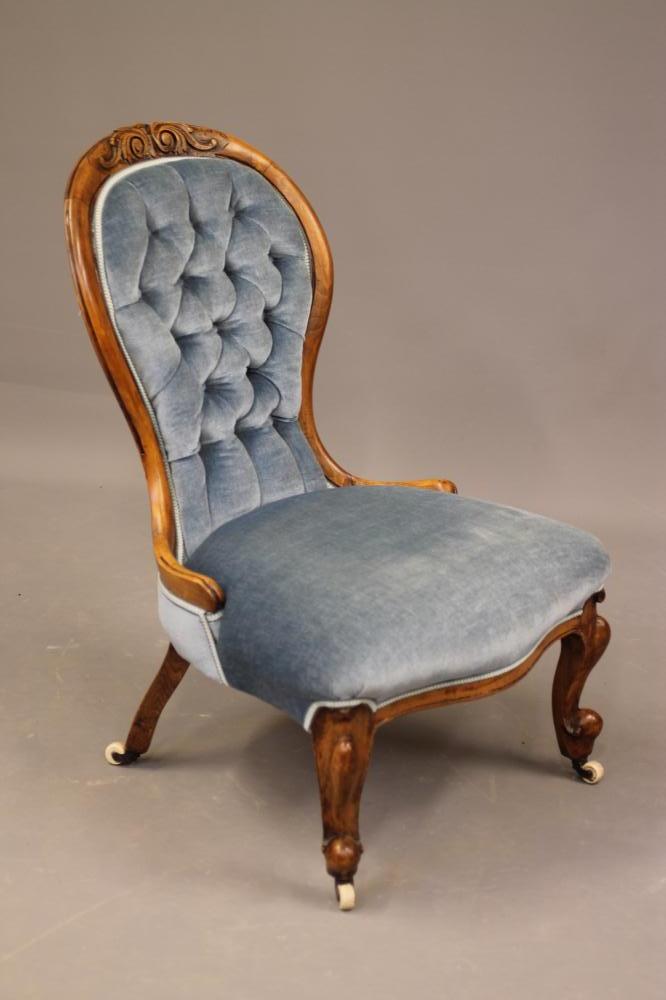 A VICTORIAN WALNUT FRAMED SALON CHAIR of spoonback form button upholstered in pale blue dralon Image