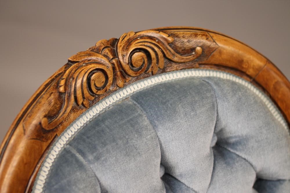 A VICTORIAN WALNUT FRAMED SALON CHAIR of spoonback form button upholstered in pale blue dralon Image