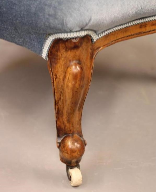 A VICTORIAN WALNUT FRAMED SALON CHAIR of spoonback form button upholstered in pale blue dralon Image