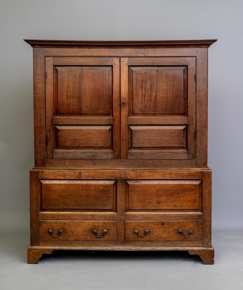 AN OAK LIVERY CUPBOARD Image
