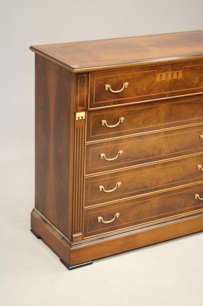 A WALNUT AND EBONISED SECRETAIRE CHEST Image