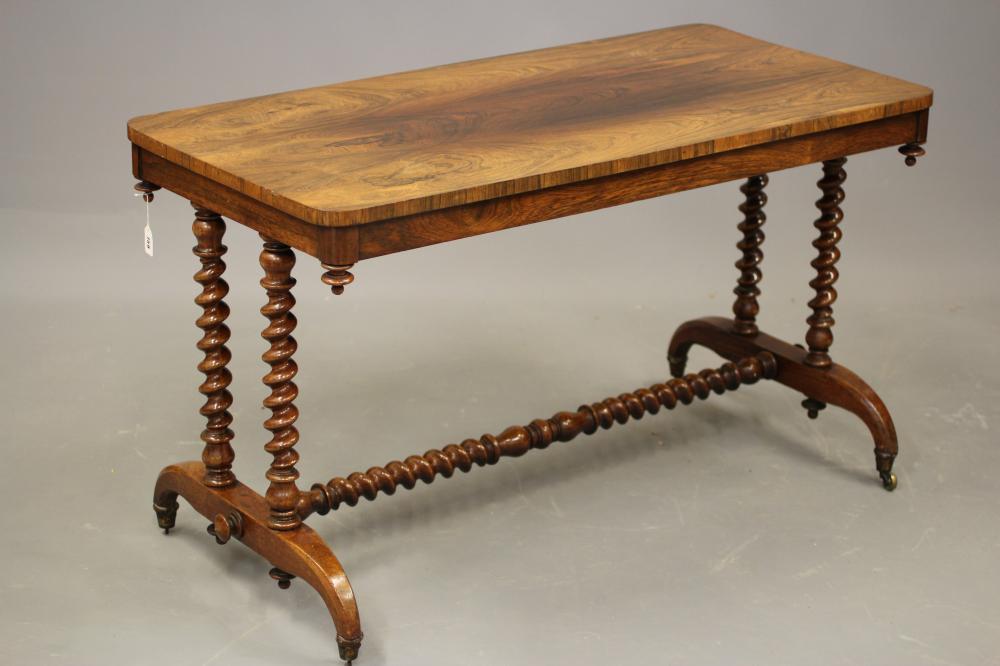 A VICTORIAN ROSEWOOD LIBRARY TABLE Image