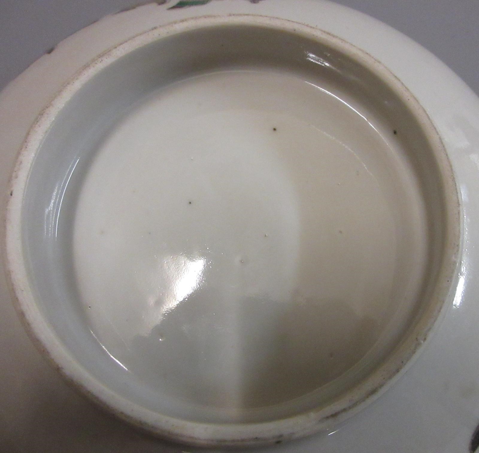 A CHINESE PORCELAIN FAMILLE VERTE BOWL of plain circular form painted with a seated Hotei with Image