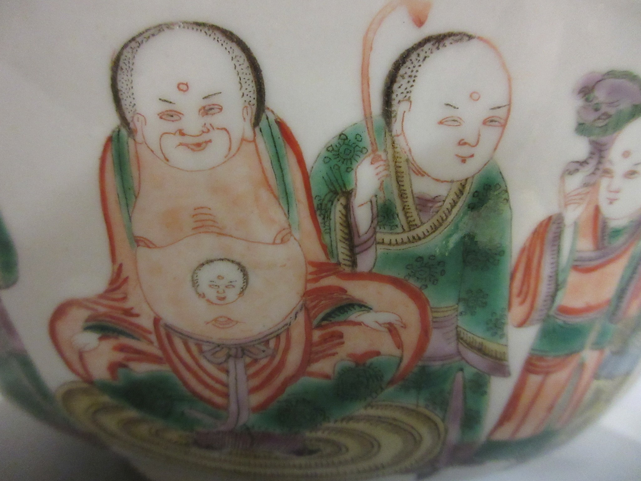 A CHINESE PORCELAIN FAMILLE VERTE BOWL of plain circular form painted with a seated Hotei with Image