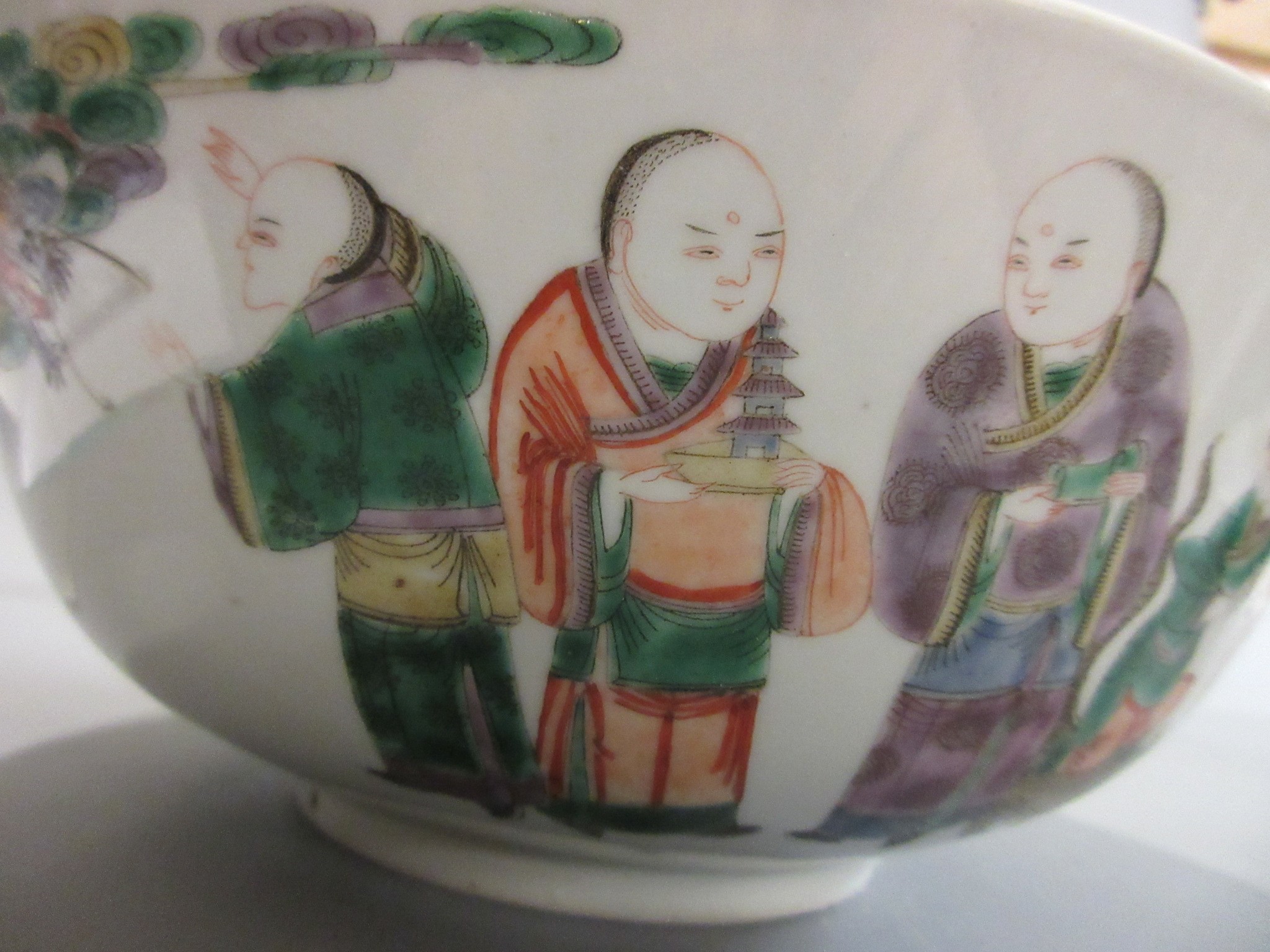 A CHINESE PORCELAIN FAMILLE VERTE BOWL of plain circular form painted with a seated Hotei with Image