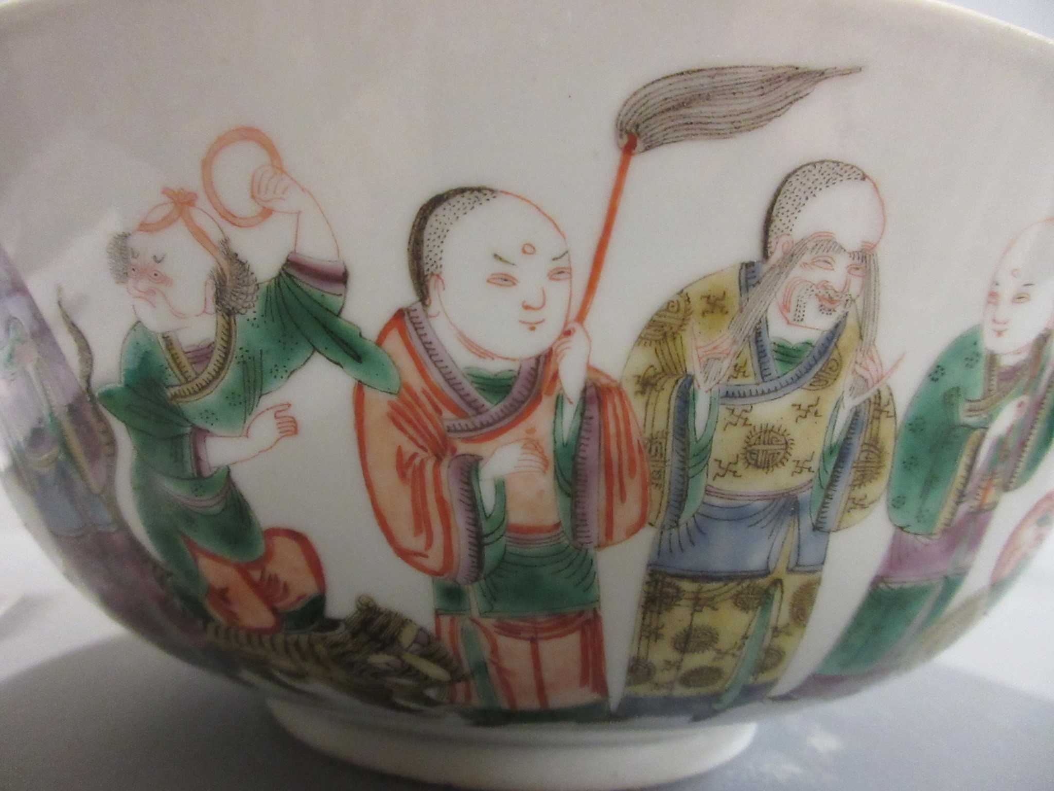 A CHINESE PORCELAIN FAMILLE VERTE BOWL of plain circular form painted with a seated Hotei with Image