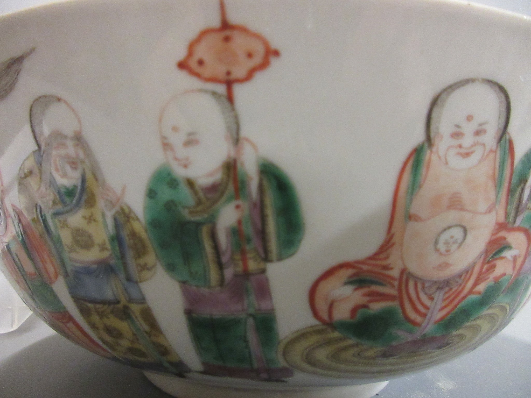 A CHINESE PORCELAIN FAMILLE VERTE BOWL of plain circular form painted with a seated Hotei with Image