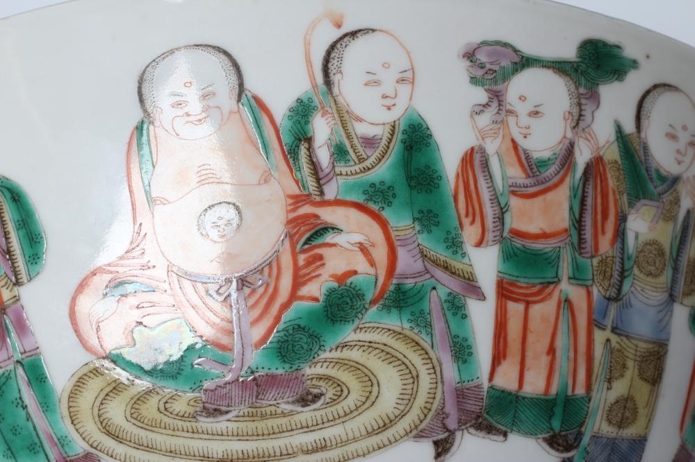 A CHINESE PORCELAIN FAMILLE VERTE BOWL of plain circular form painted with a seated Hotei with Image