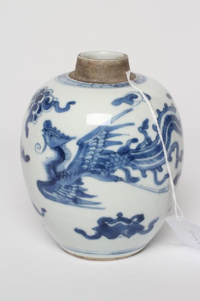 A CHINESE PORCELAIN JAR of ovoid form, painted in underglaze blue with two dragons chasing the Image