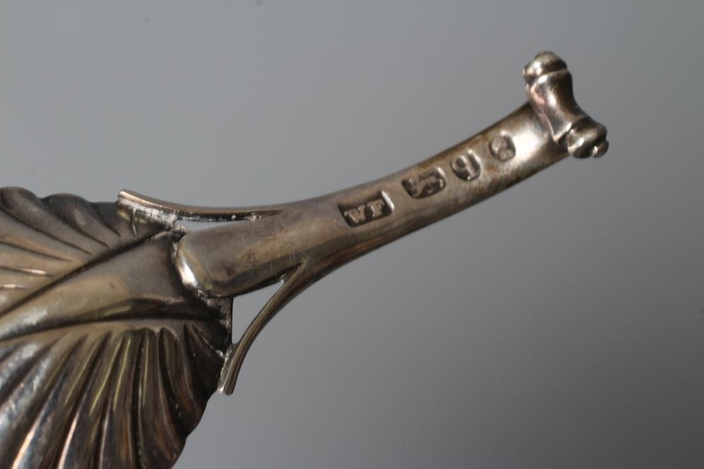 A WILLIAM IV SILVER CADDY SPOON, maker's mark WF, London 1831, the leaf shaped bowl with scroll Image