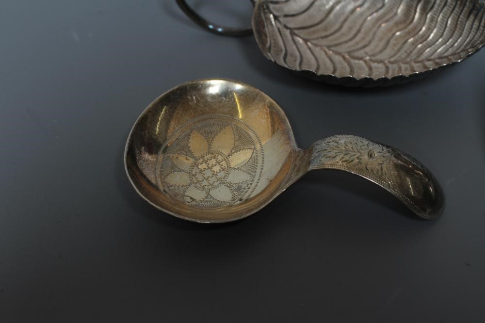 A GEORGE III SILVER LEAF CADDY SPOON by Edward Mayfield or Elizabeth Morley Image