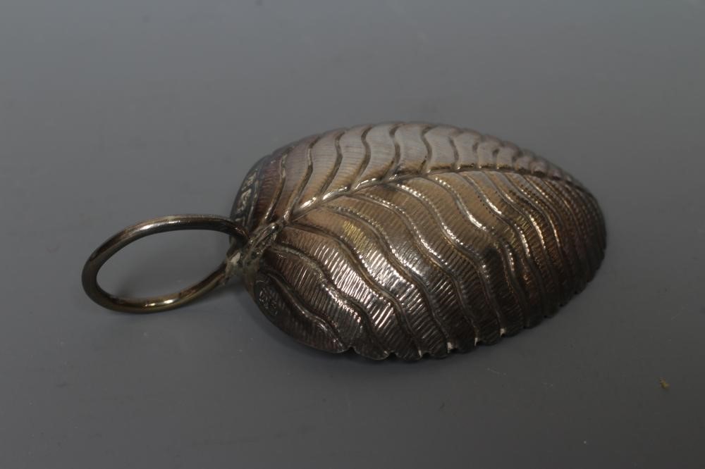 A GEORGE III SILVER LEAF CADDY SPOON by Edward Mayfield or Elizabeth Morley Image