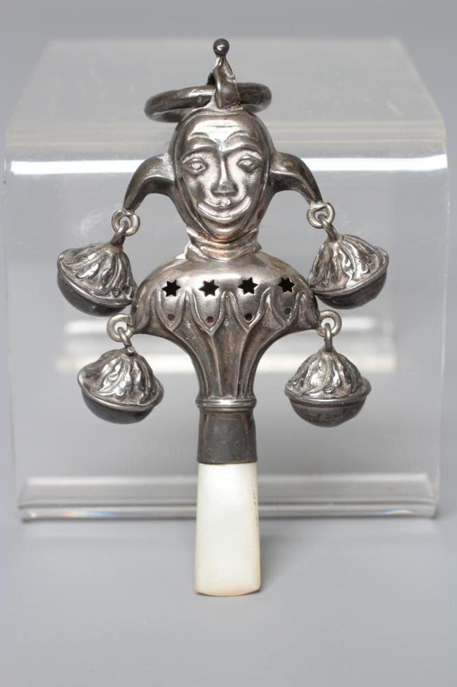 A SILVER RATTLE/TEETHER by Wilmot Man. Co., Birmingham 1918, in the form of a jester with four bells Image